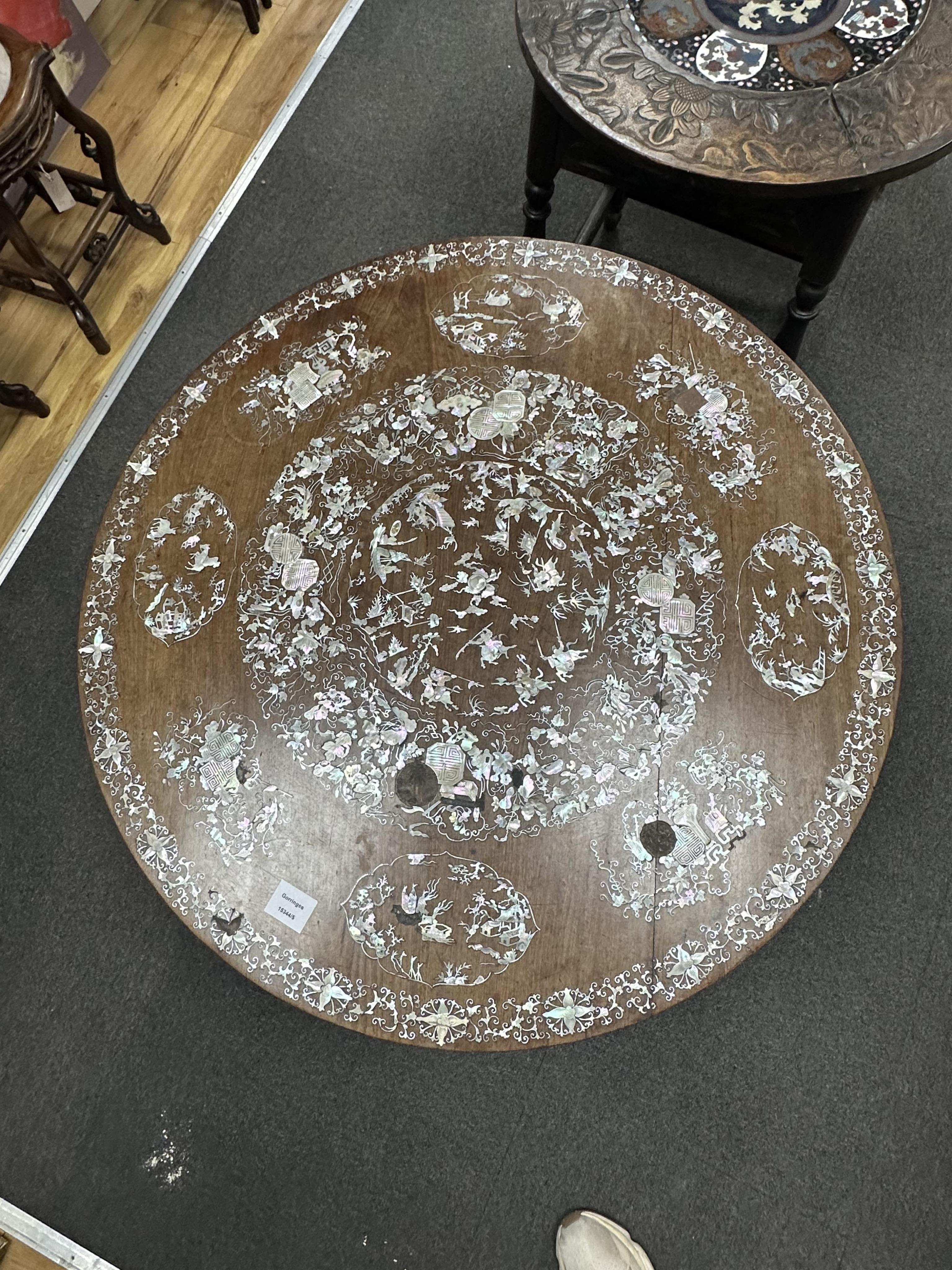 A circular Chinese export hardwood and mother of pearl inlaid centre table, diameter 85cm, height 64cm. Condition - cracked and some losses to the top and elsewhere